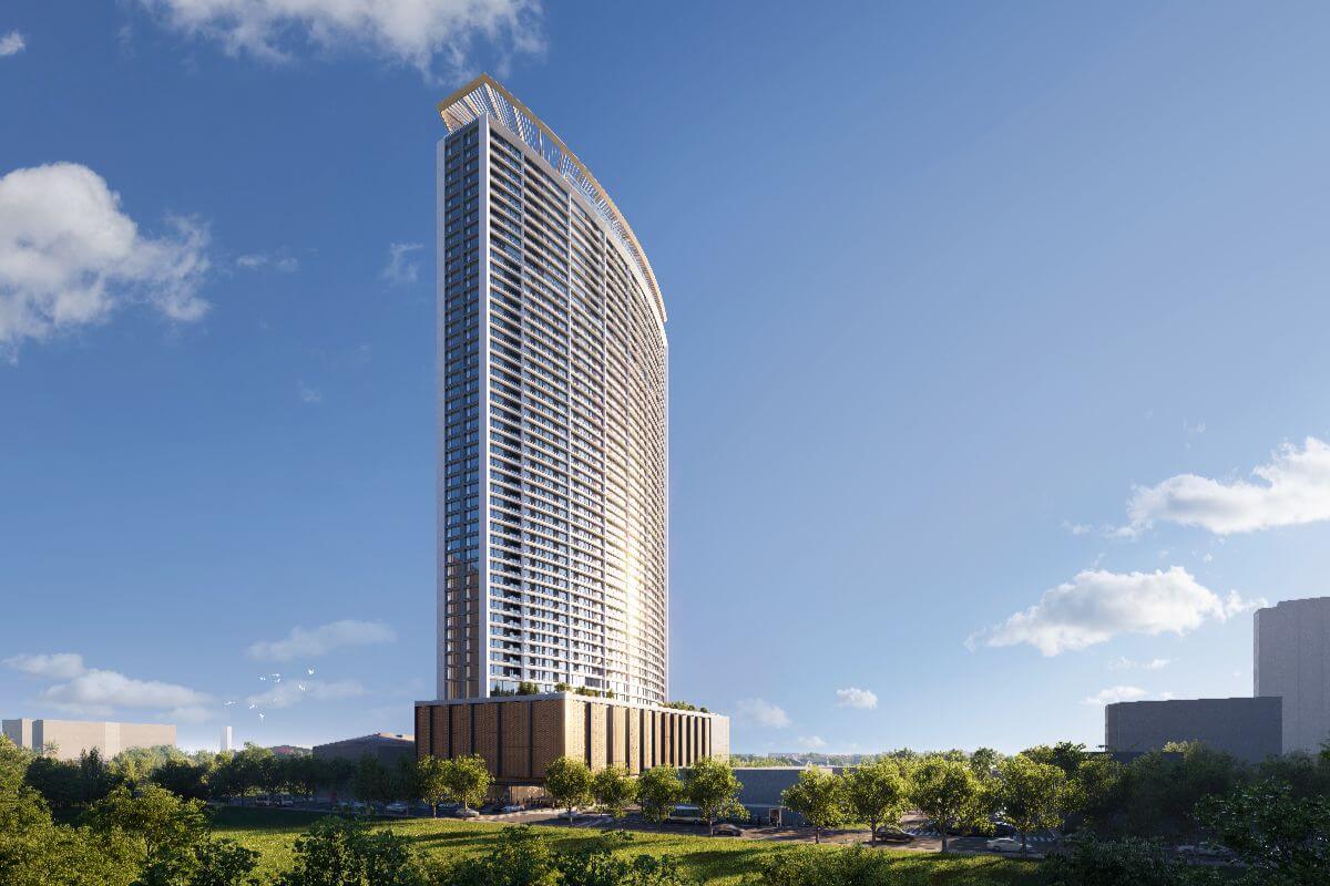 Shang Bauhinia Residences luxury condominium tower rising above landscaped grounds with a sleek modern architectural design.