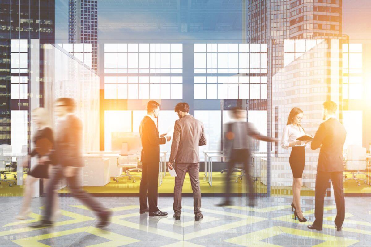 Businessmen and businesswomen in a busy business district near a luxury condominium development, reflecting an active urban lifestyle.