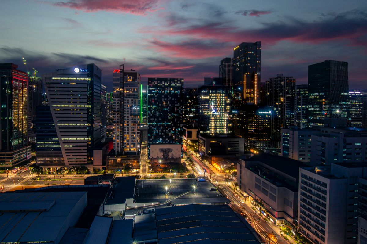 Makati city skyline at dusk showcasing prime urban locations for luxury real estate in the Philippines