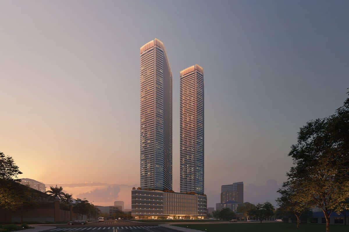 Twin luxury residential towers at sunset representing Shang Properties’ proven track record in premium urban development