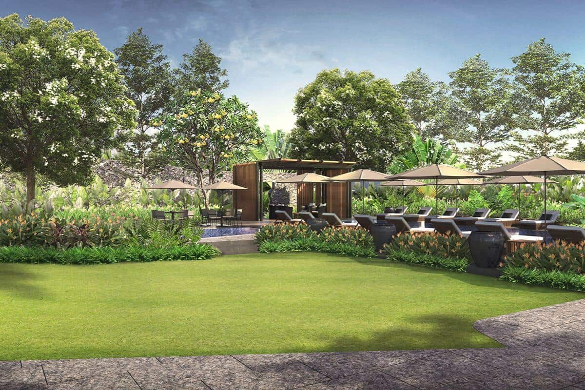 Landscaped garden and outdoor lounge area in a premium urban residential development surrounded by lush greenery