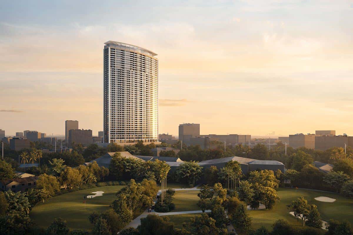 Luxury high-rise condominium overlooking a green golf course and city skyline, highlighting a prime Shang Properties location