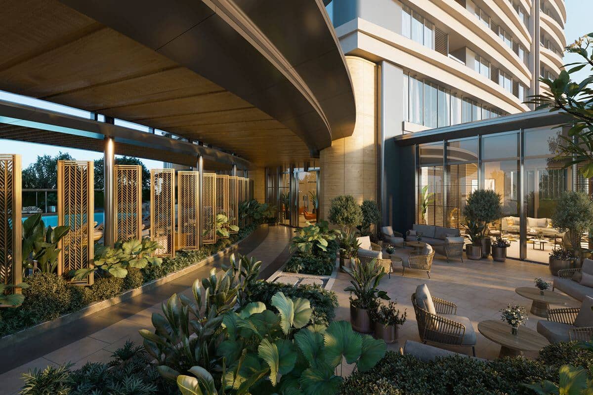 Landscaped condominium amenity area with outdoor seating, greenery, and modern architecture maintained for resident use