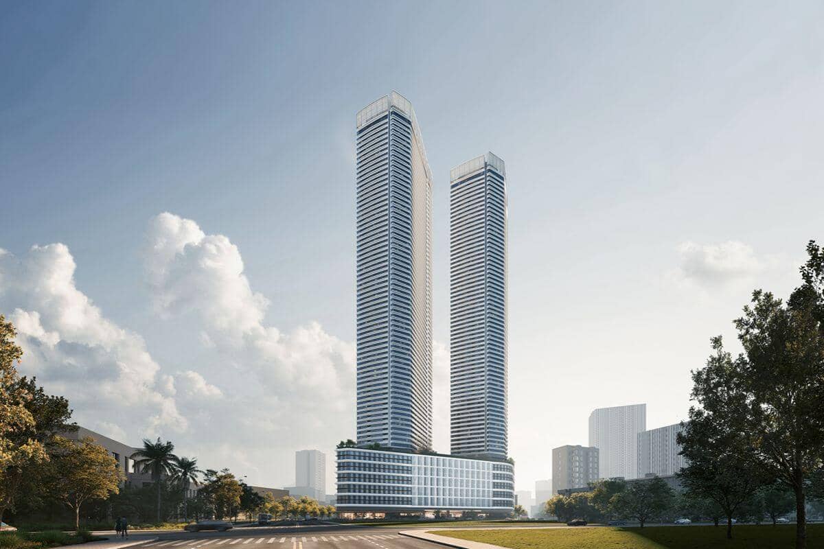 Twin luxury residential towers rising above a landscaped urban setting, representing integrated mixed-use living by Shang Properties