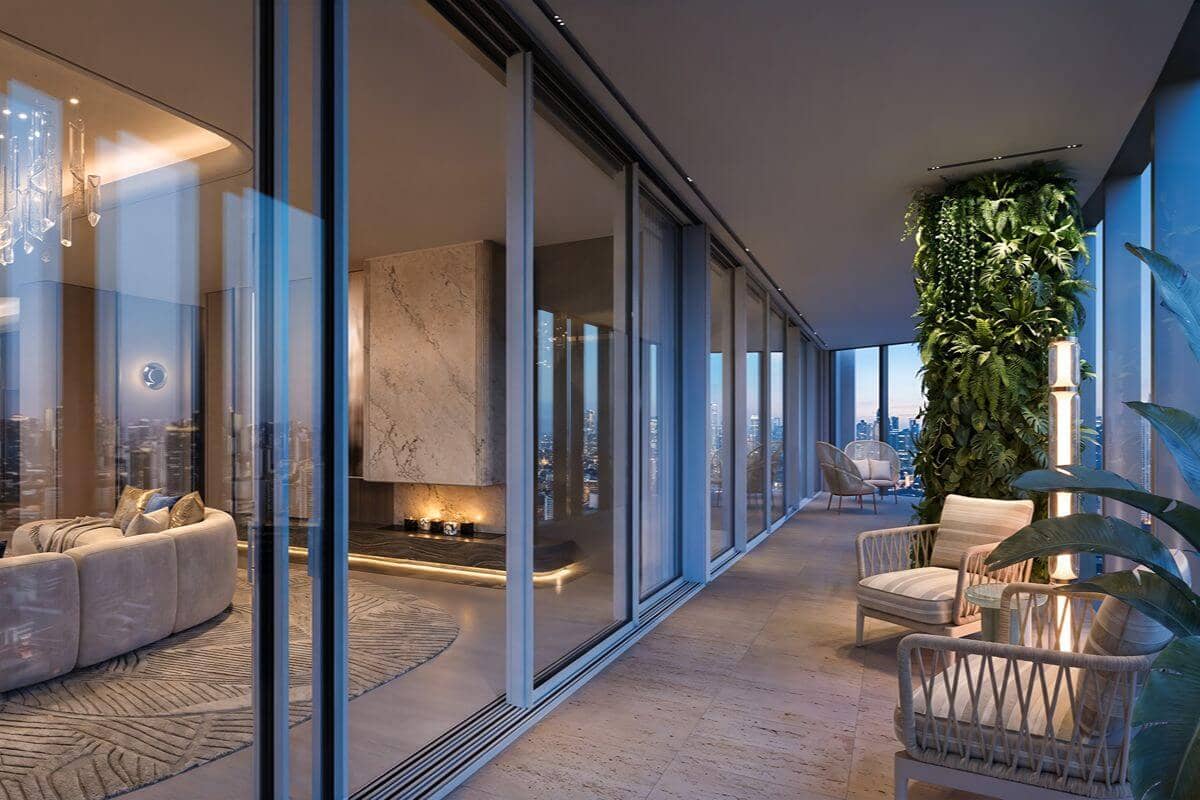 Luxury condominium balcony with comfortable seating and greenery, offering a convenient private space connected to the residence