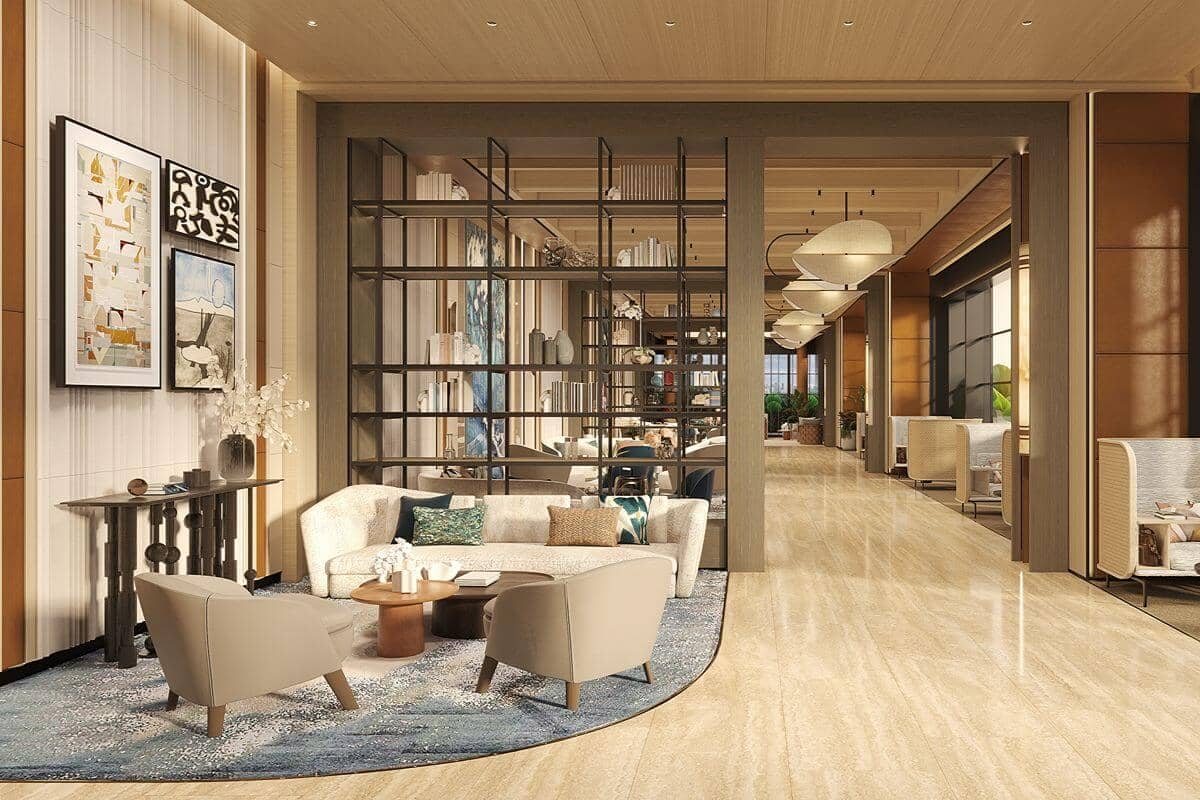 Refined residential lounge with warm interiors, natural light, and thoughtfully arranged seating designed for comfort and everyday living